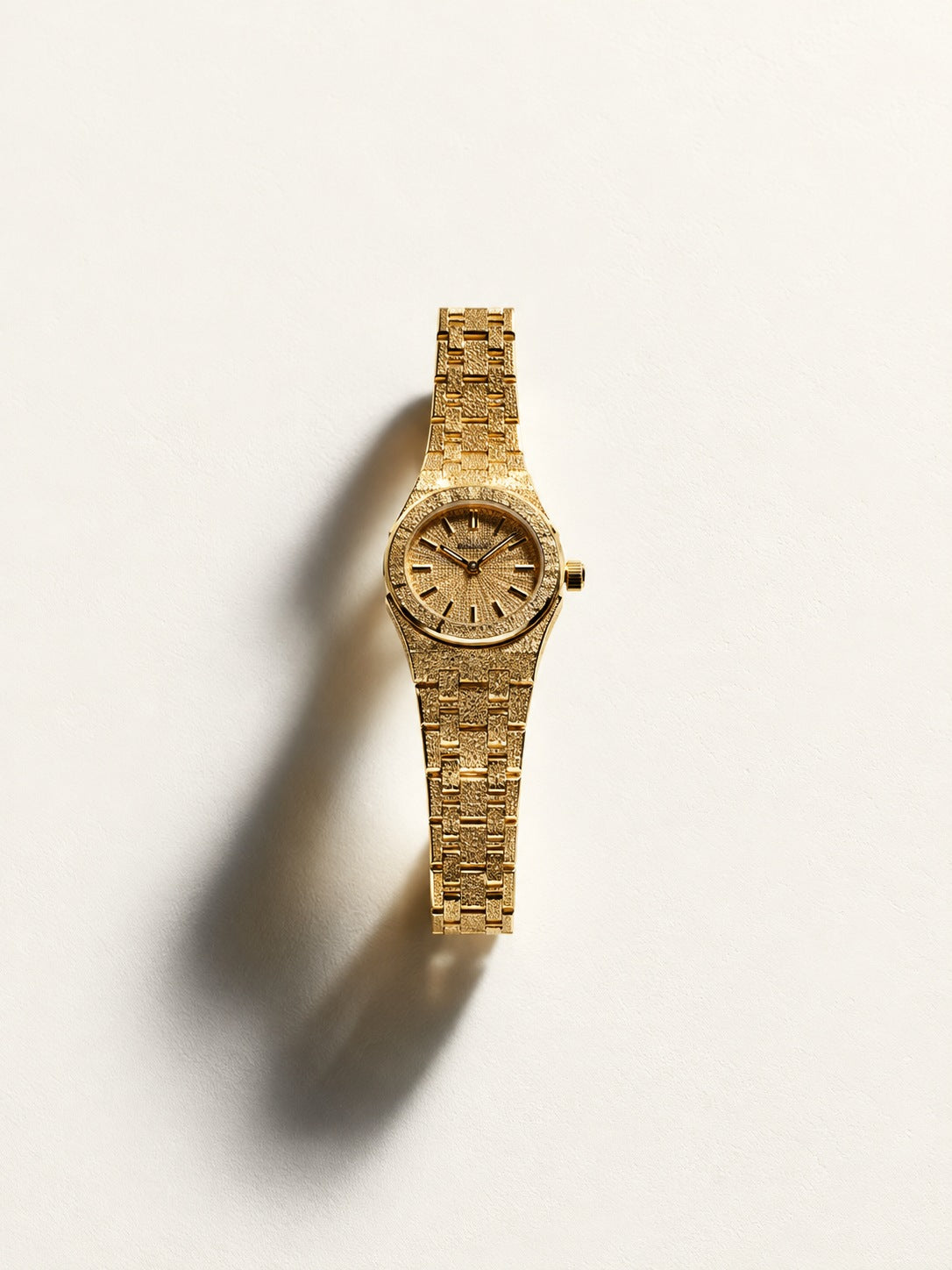 Gold watch in sculptural light