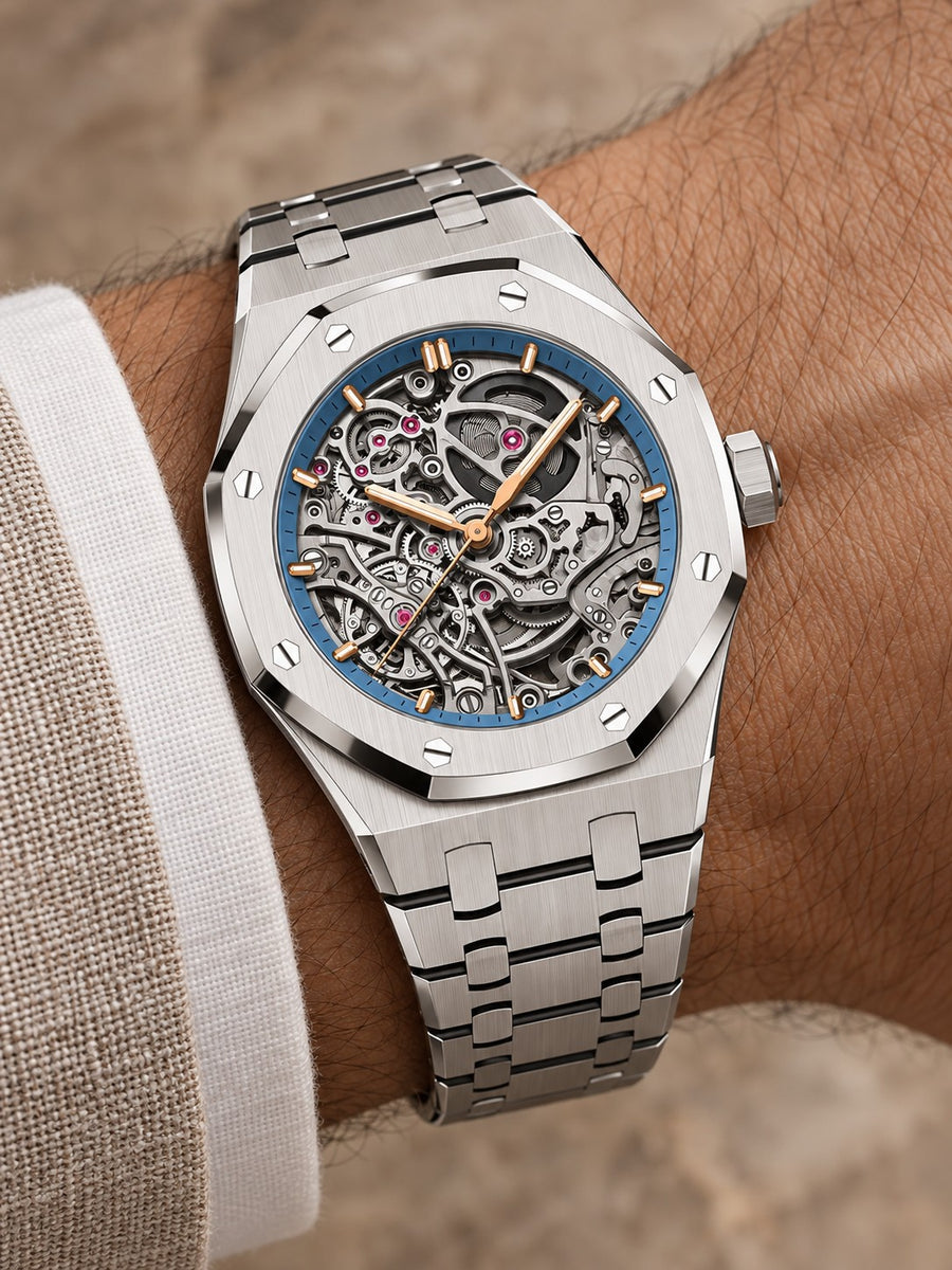 Silver-Tone Open-Work Skeleton Watch – Blue Accent Integrated Bracelet